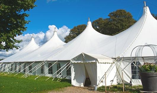 a line of sleek and modern portable toilets ready for use at an upscale corporate event in Deerfield, NY